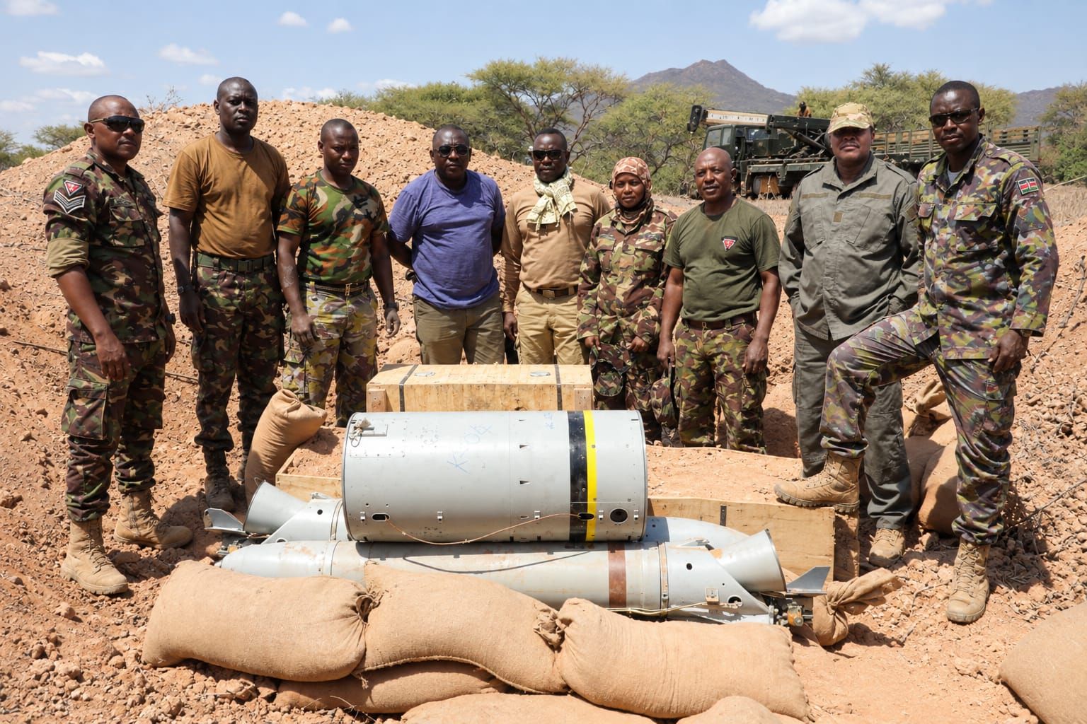 Stanfajoy team at a sandbagged demolition pit with aerial bombs